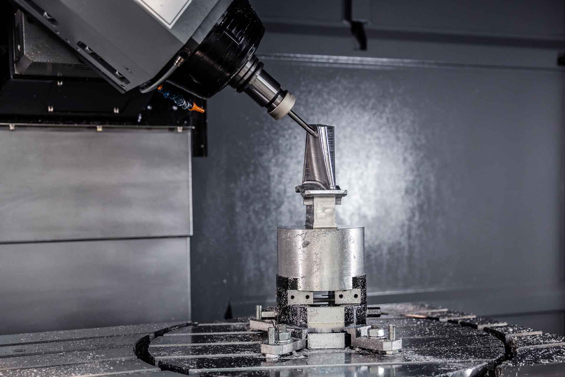 CNC milling machine cutting metal with precision in a UK manufacturing facility